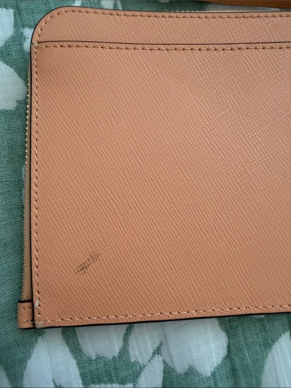 kate spade peach/orange leather wristlet with gold logo